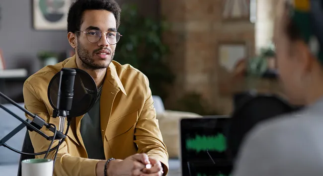 Entrepreneur with headphones in a recording studio