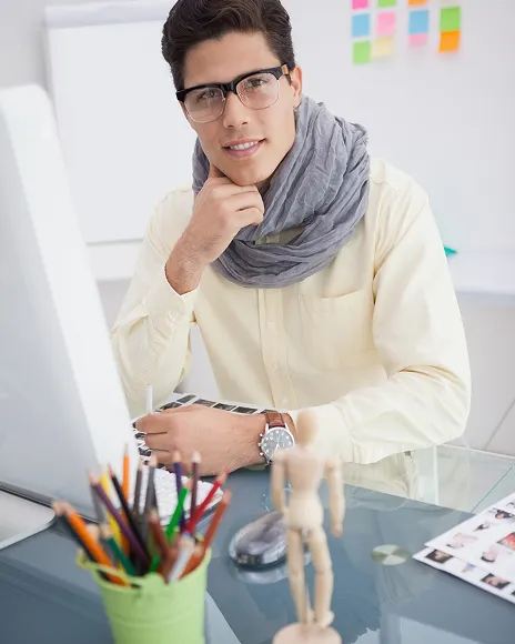 Smiling man resting his chin on his hand, representing a subject-matter expert