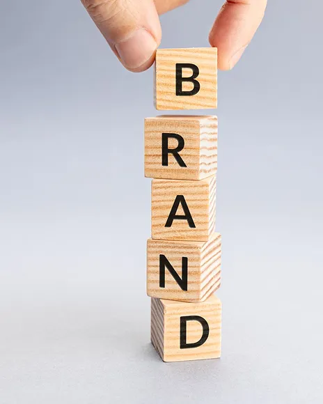 Wooden blocks spelling BRAND, representing personal brand credibility