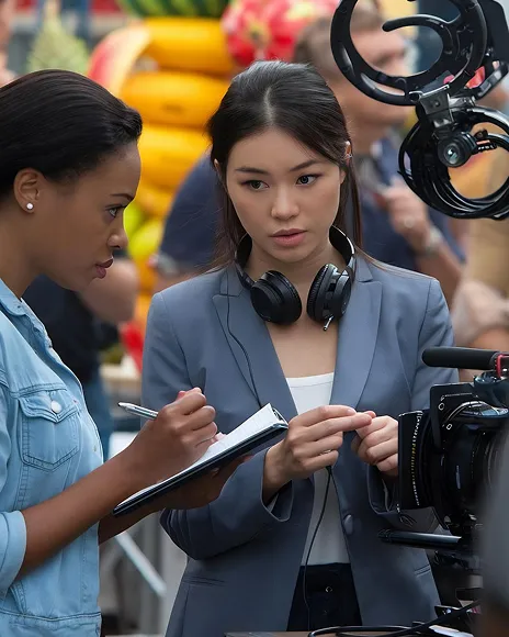 Journalist with a camera crew preparing an editorial feature