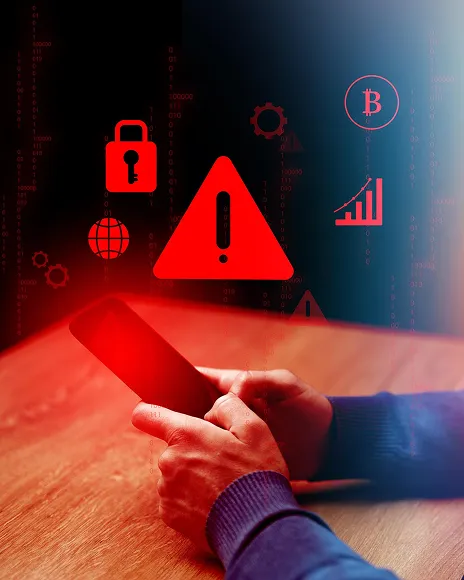 Red warning triangle and padlock on a phone, representing a coordinated reputation attack